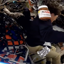 A jar of Nutella floats in zero gravity aboard the Artemis II spacecraft orbiting the moon. 