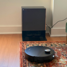 Dreame X60 Max Ultra Complete robot vacuum cleaning rug in front of dock