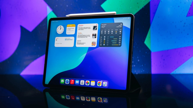 ipad air against blue abstract backdrop 