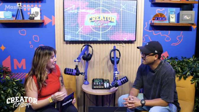 Two people talking in a podcast studio
